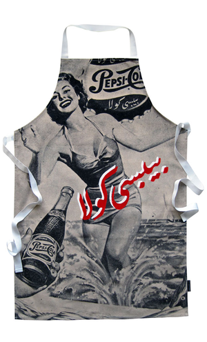Kitchen apron that has a drawing of well dressed woman drinking from a glass with fruits in the background